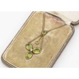 A late Victorian or Edwardian peridot pendant necklace,