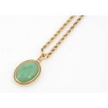 A jadeite pendant on chain,