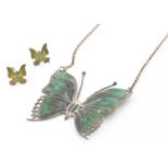 A silver and enamel butterfly pendant on chain,