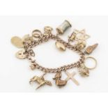 A 9ct gold and yellow metal charm bracelet,