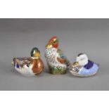 Three Royal Crown Derby bone china duck paperweights,