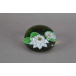 A Baccarat glass paperweight,