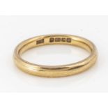 A 22ct gold wedding band,