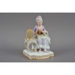 A restored 19th century Meissen porcelain figurine of a lady and bird,