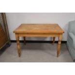An Edwardian pitch pine kitchen table,