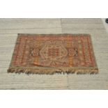 A middle Eastern flat weave rug,