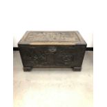 A 20th century carved Chinese camphor chest,