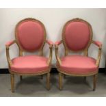 A pair of French Louis XV style armchairs,