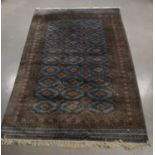 A shiny Pakistani woollen rug,