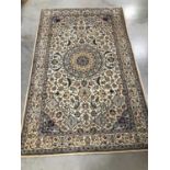 A Persian woollen rug,