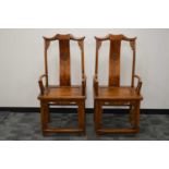 A pair of impressive Chinese hardwood marriage armchairs,