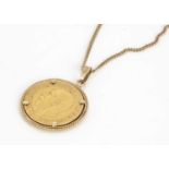 A George V full sovereign and chain,