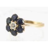 An 18ct gold diamond and sapphire cluster dress ring,