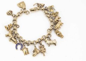 A yellow metal circular linked and baton linked bracelet with yellow and 9ct gold charms,