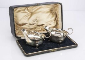 A pair of cased George V silver sauce boats by ESB,