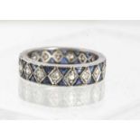 A white metal sapphire and diamond full eternity ring,