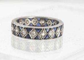 A white metal sapphire and diamond full eternity ring,
