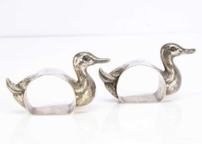 A pair of George V silver novelty napkin rings,