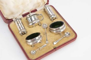 A cased George V silver five piece cruet set,