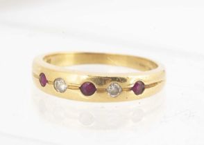 An 18ct gold ruby and diamond dress ring,