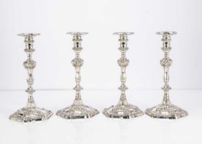 A fine set of four George III cast silver candlesticks by Ebenezer Coker,
