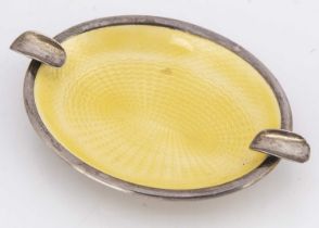An Art Deco period yellow enamelled ashtray,