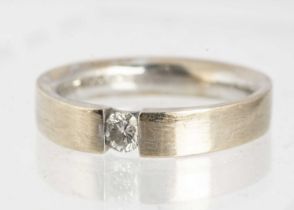 An 18ct white gold diamond tenson ring,