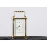 A modern brass carriage timepiece from the London Clock Co,