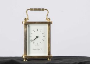 A modern brass carriage timepiece from the London Clock Co,