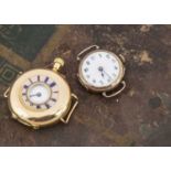 An early 20th century Continental 18ct gold half hunter lady's watch and a damaged 9ct gold lady's w