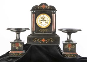 A Victorian slate mantle clock and garniture,