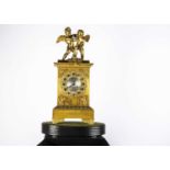 A late 19th or early 20th century gilt mantle clock,