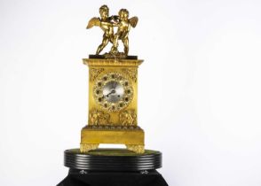 A late 19th or early 20th century gilt mantle clock,