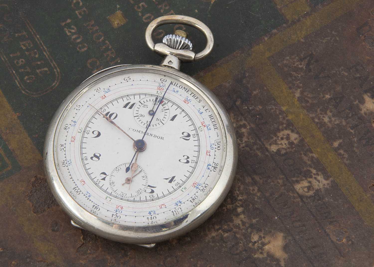An early 20th century silver pocket watch with stop watch facility,
