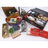 A large collection of watch and clock spare parts and workshop tools and items,