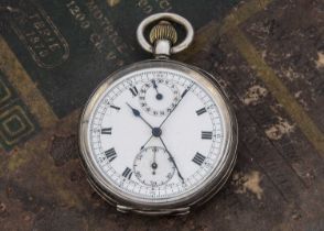 An early 20th century silver pocket watch with stop watch facility probably by Minerva,