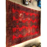 A large and damaged colourful oushak woollen rug,