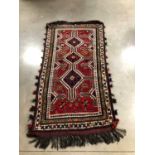 A woollen Iranian rug,