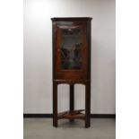 A 19th century and later mahogany corner cabinet and stand,