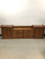 An Edwardian ecclesiastical pitch pine cabinet,