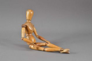 A 20th century wooden articulated figure,