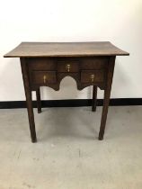 A small 18th century and later oak lowboy,
