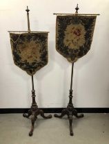 A pair of Victorian pole screens,