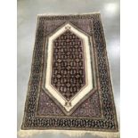 A Middle Eastern woollen rug,