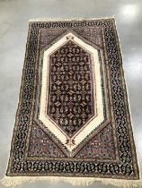 A Middle Eastern woollen rug,