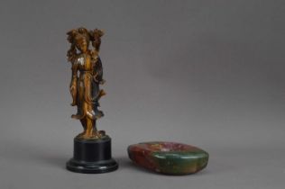 A Chinese carved tiger eye figure of Guanyin,