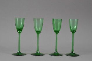 A set of four Art Deco period continental green glass liquor glasses,