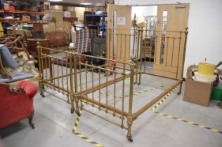 Two first half 20th century brass and cast iron single bed frames