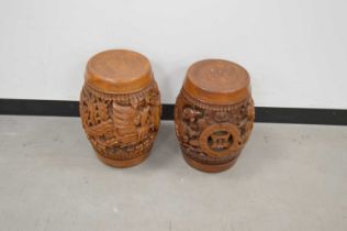 A pair of Indonesian carved hardwood drum stools,