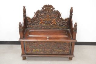 An Indonesian carved wooden wedding bench,